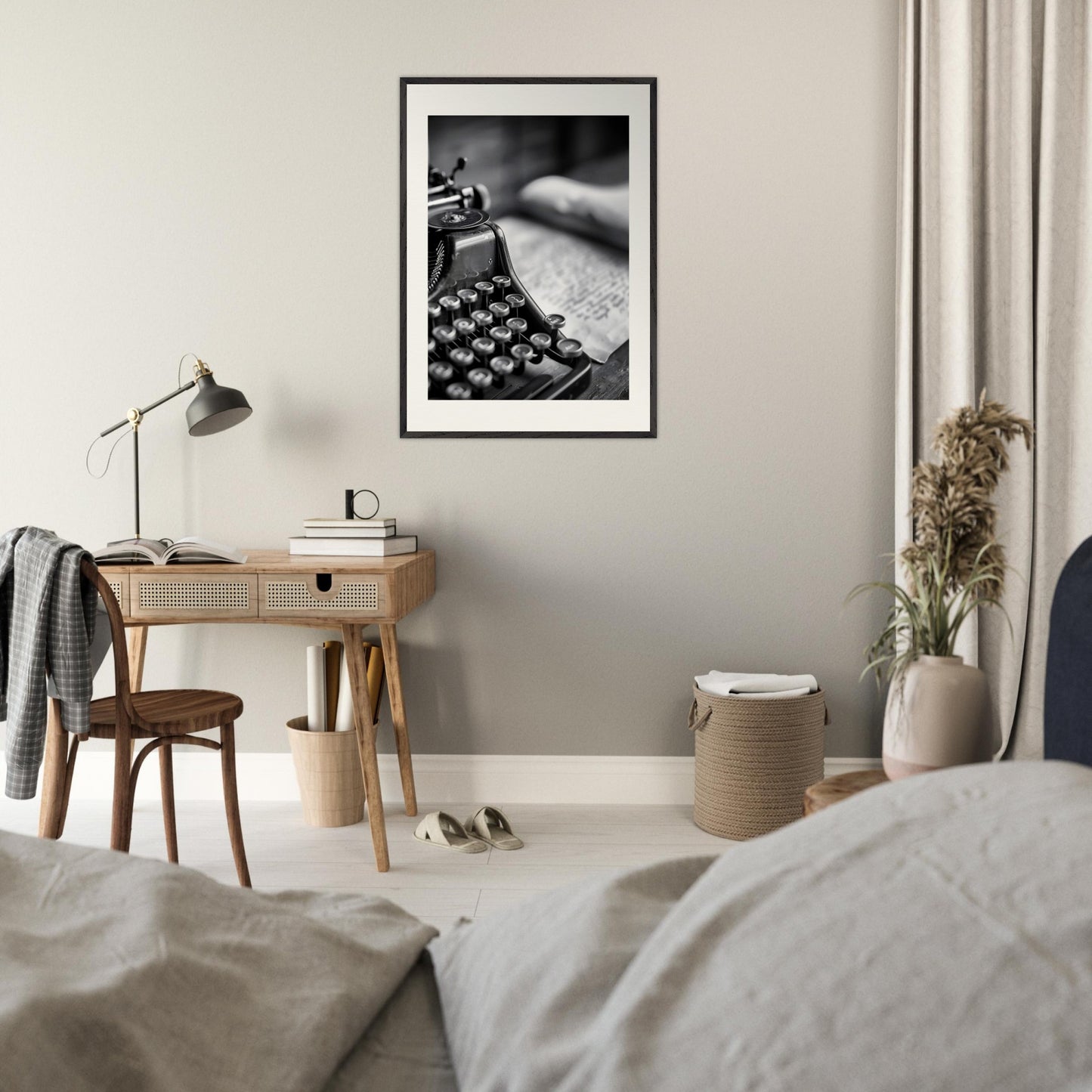 This is a black and white illustration of an old-fashioned typewriter with a blurred background.