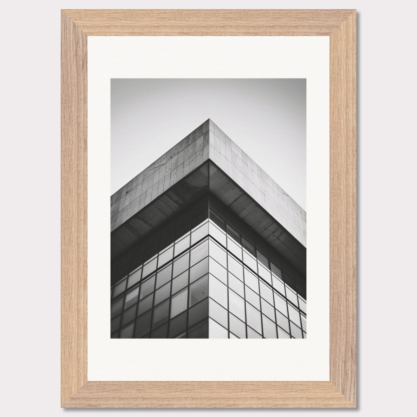 This striking black and white photograph captures the sharp, geometric lines of a modern architectural structure. The image focuses on the corner of a building, emphasizing its sleek glass windows and concrete elements.