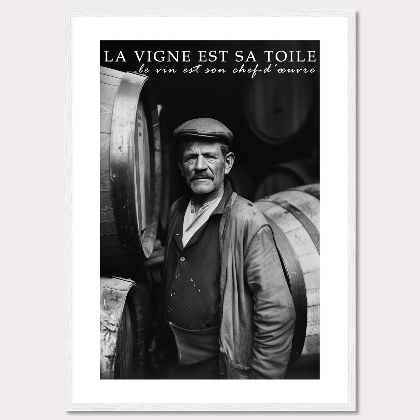 This striking black-and-white photograph captures a seasoned winemaker standing proudly among wine barrels. The text above reads, "La vigne est sa toile, le vin est son chef-d'œuvre," which translates to "The vineyard is his canvas, the wine is his masterpiece." The image exudes a sense of dedication and craftsmanship.