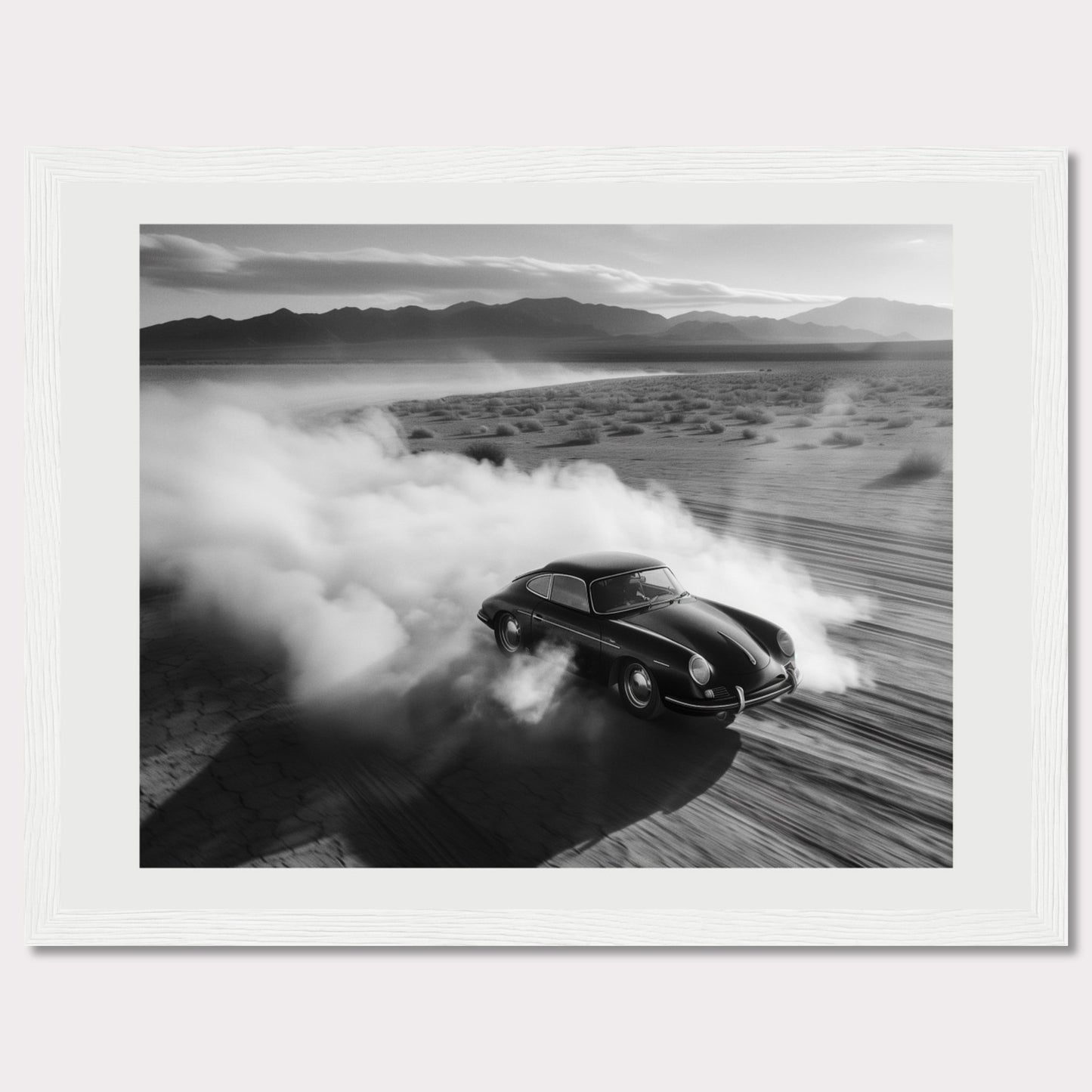 This striking black and white photograph captures a classic car speeding through a desert landscape, leaving a trail of dust in its wake. The image exudes a sense of freedom and adventure, with the distant mountains adding to the dramatic scenery.