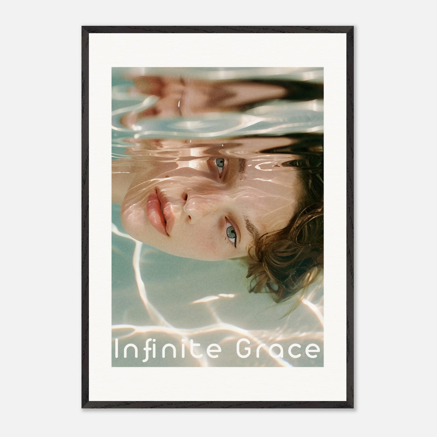 This is an illustration of a person's face partially submerged in water, creating a reflective and serene effect. The text "Infinite Grace" is displayed at the bottom of the image.

Where will this poster fit: This poster would fit well in a modern living room, a bedroom, or a creative studio space.