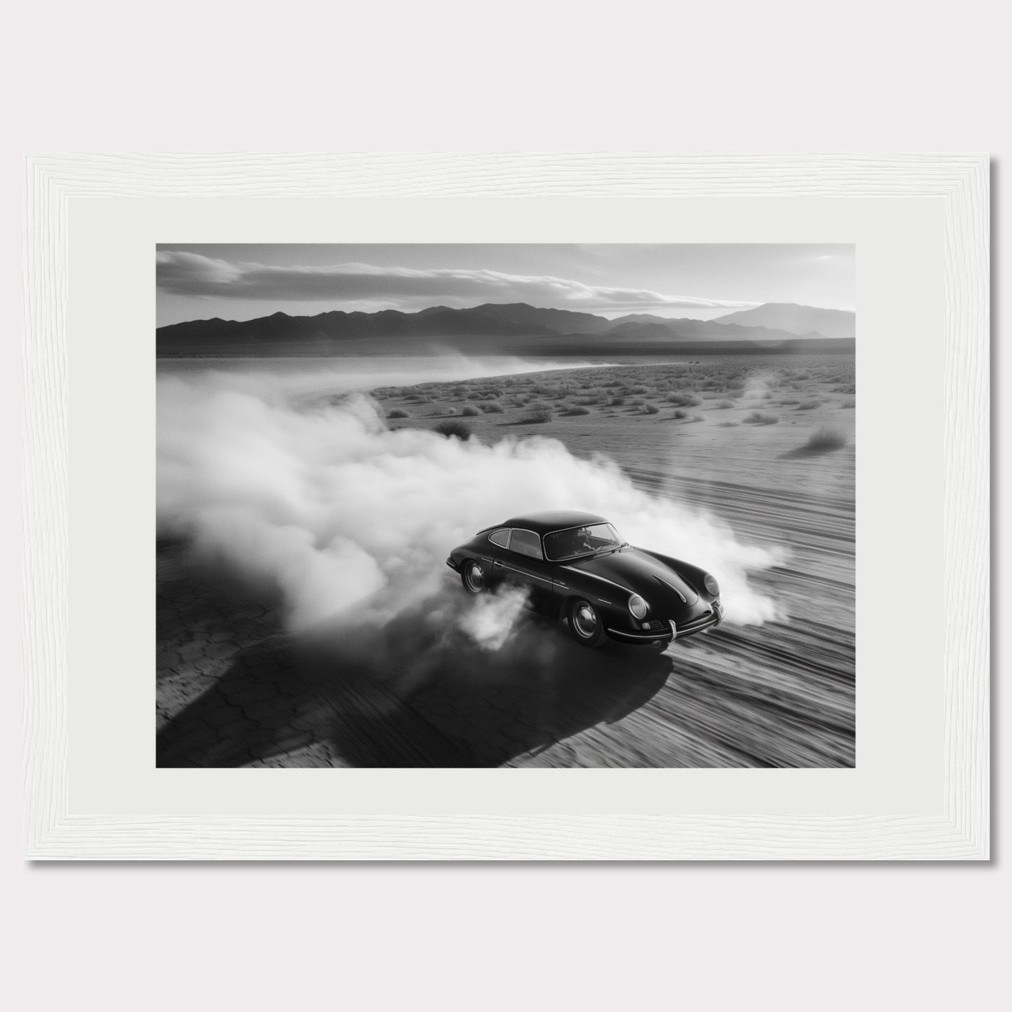 This striking black and white photograph captures a classic car speeding through a desert landscape, leaving a trail of dust in its wake. The image exudes a sense of freedom and adventure, with the distant mountains adding to the dramatic scenery.