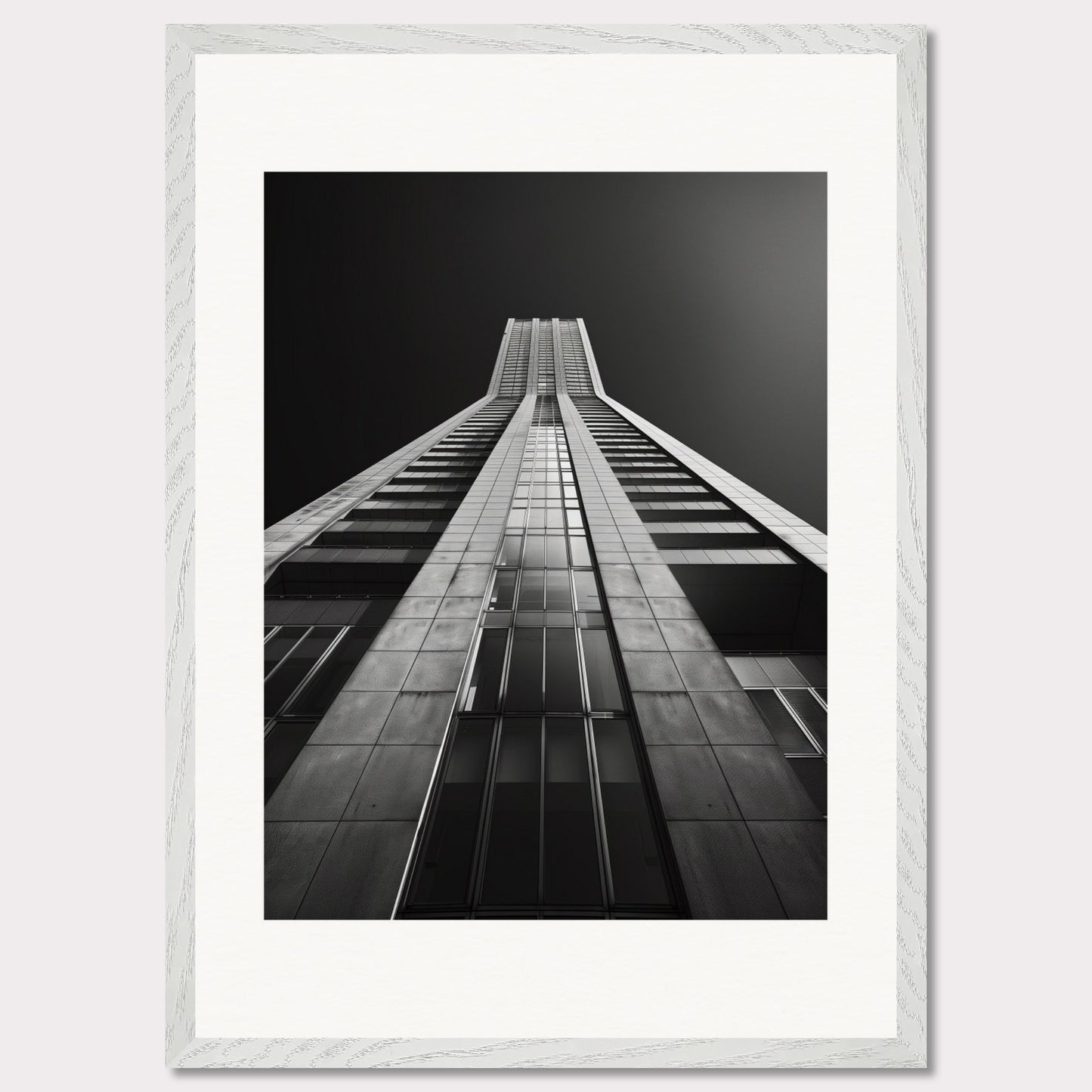 This striking black and white photograph captures the awe-inspiring perspective of looking up at a towering skyscraper. The image emphasizes the sleek lines and modern architecture, drawing the viewer's eye upwards towards the sky.